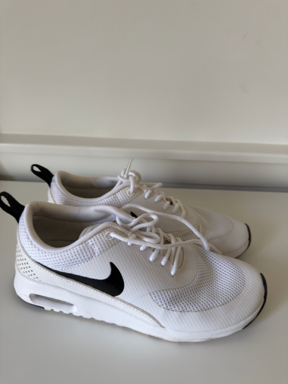 White Nike Air Max-Style Trainers with Black Swoosh